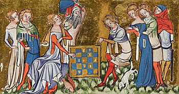Bild av många människor runt ett schackspel, där en kvinna och en man spelar