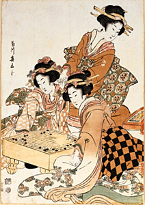 Tre japanska kvinnor varav två spelar ett schackliknande spel