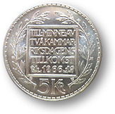 Foto av runt mynt à 5 kronor med texten "Till minne av tvåkammarriksdagens tillkomst 1866
