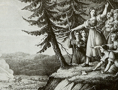 Illustration av en kvinna som driver på andra kvinnor och pekar med en huggare mot ett läger vid botten av berget de står på
