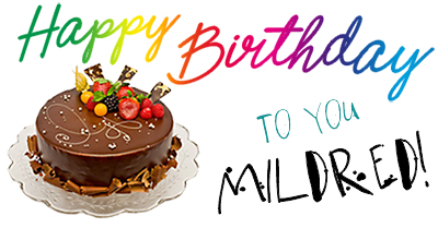 Foto av chokladtårta med diverse frukt på bredvid texten: Happy Birthday to you, Mildred!