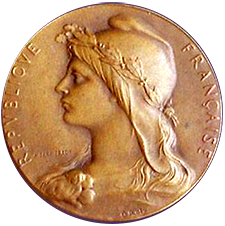 Medalj från den franska republiken föreställande Marianne i profil iförd den typiska mössan